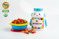 kids gummy container with gummy outside in kids bowl with FDA sign, organic and nuetrious logo